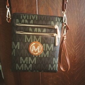 New no tags. NOT a Michael Kors.  But a very cute crossbody